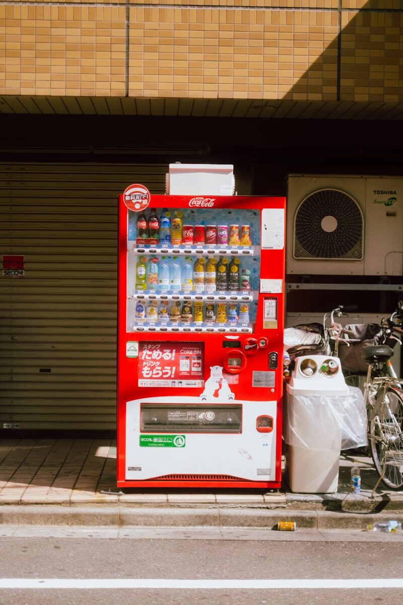 A vending machine sitting on the side of a road